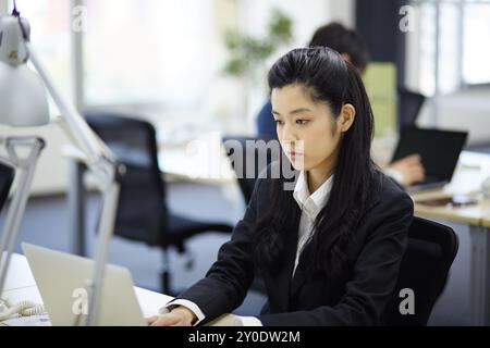 A businesswoman doing deskwork Stock Photo