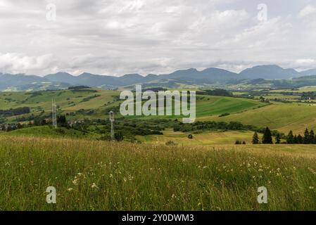 Beautiful Liptov region in Slovakia with rolling rural landscape and Chocske vrchy mountains - view above Vysny Sliac village during springtime mostly Stock Photo