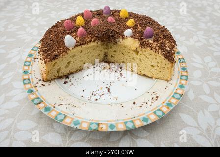 an Easter sponge cake with mini chocolate eggs for decoration Stock Photo