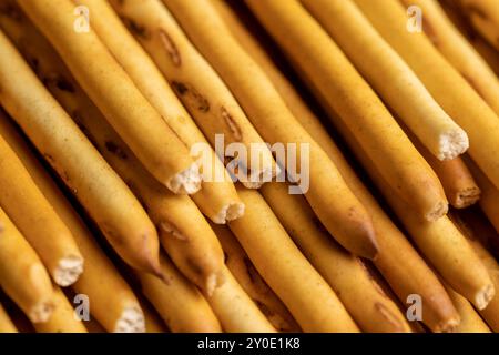 Thin and long bread sticks made of wheat flour on the table , sweet wheat pastries on the table for dessert Stock Photo