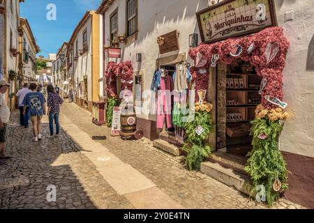 Small shop in the Obidos, a walled Portuguese town, a tourist destination in the Lisbon region. Charming and attractive city in Portugal. Europe Stock Photo