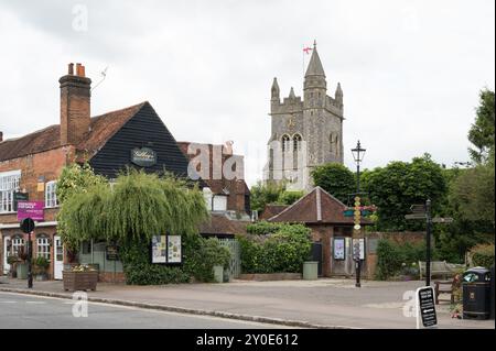 Street view of Market Square with St Mary the Virgin Church tower and Gilbey's restaurant (now closed) Old Amersham Buckinghamshire England UK Stock Photo