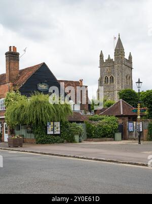 Street view of Market Square with St Mary the Virgin Church tower and Gilbey's restaurant (now closed) Old Amersham Buckinghamshire England UK Stock Photo