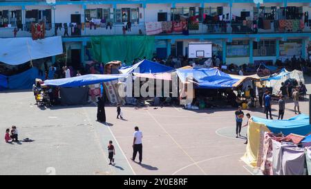 Gaza, Palestine. 20 October 2023. Tents have been set up next to an UNRWA school in Deir al Balah, to be used as shelter by displaced Palestinians during the ongoing Israeli military offensive in Gaza. The Gaza Strip has been under heavy bombardment for the 14th consecutive day, with a large number of displaced Palestinians struggling to find safety in the besieged and overcrowded tiny Palestinian enclave Stock Photo