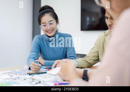 Creative Team Collaborating on UX UI Design Project in Modern Office Environment Stock Photo
