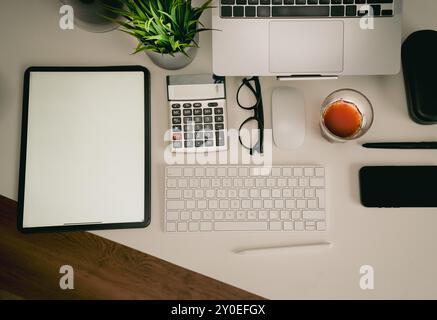 Graphic tablet blank screen mockup. Home office table. Creative equipment. Stock Photo