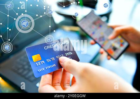 Hands holding a credit card and using smart phone for online shopping, Marketplace platform and digital marketing concept Stock Photo