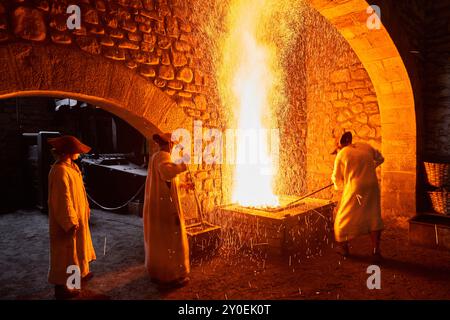 Ferrones forging iron as in the 16th century, Forge, Ferrería de Mirandaola, Mirandaola Ironworks, Legazpi, Gipuzkoa, Basque Country, Spain. Stock Photo