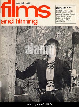 Films and Filming Mar 1968 - Vintage magazine cover -  Photographer unknow - Text transcription  [ films march 1967 3s 75c and filming Vanessa Redgrave David Hemmings In ANTONIONI'S THE BLOW UP 1967: SWING BACK TO MUSICALS? Vanessa Redgrave Sarah Miles David Hemmings THE BLOW UP George Chakiris Gene Kelly Catherine Deneuve YOUNG GIRLS OF ROOFIEFORT TWENTY PAGES ON MUSICALS OLD AND NEW Samantha Eggar Rex Harrison Anthony Newley DR. DOLITTLE Sidney Poitier TO SIR, WITH LOVE Tommy Steele Julie Andrews THOROUGHLY MODERN MILLIE Elvis Presley DOUBLE TROUBLE HALE A SIXPENCE  ] FOR EDITORIAL USE ONLY Stock Photo