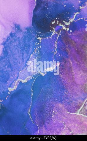 Beautiful abstract artwork featuring swirling purple and blue hues with delicate gold accents, creating a mesmerizing visual experience Stock Photo