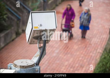 Surveillance camera with walking elderly people in the background in London Stock Photo