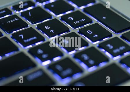 Closeup of a Backlit Laptop Keyboard Stock Photo