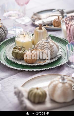 Autumn table setting with pumpkins. Thanksgiving holiday dinner and fall decoration Stock Photo