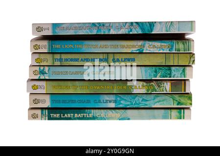 Pile of C.S. Lewis childrens books isolated on white background - The Chronicles of Narnia series of 7 Stock Photo