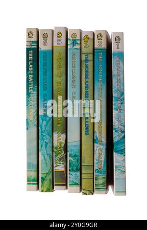Pile of C.S. Lewis childrens books isolated on white background - The Chronicles of Narnia series of 7 Stock Photo