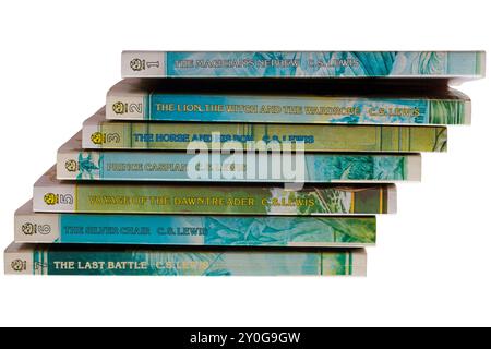 Pile of C.S. Lewis childrens books isolated on white background - The Chronicles of Narnia series of 7 Stock Photo