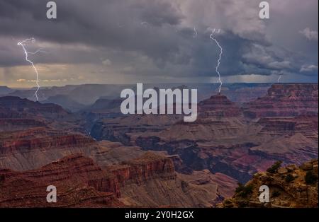 Lightning strikes viewed from Lipan Point at Grand Canyon Arizona during the 2024 Monsoon season. Stock Photo