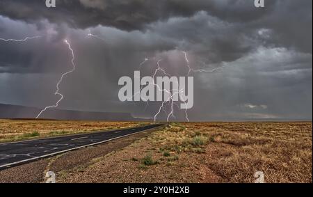 A 2024 Arizona Monsoon lightning storm over the Vermilion Cliffs National Monument. Three lightning photos were captured with a lightning detector and Stock Photo