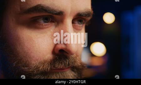 Developer in home office concentrating hard while doing coding on computer, extreme close up shot. Focus on IT admin paying close attention to screen while writing lines of code, camera B Stock Photo