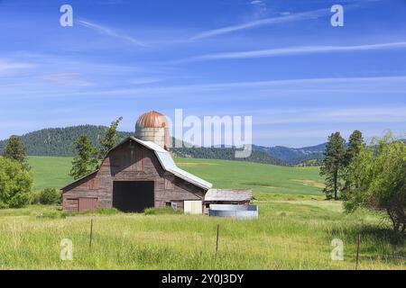 Barn and silo on highway 3 located near Harrison, Idaho Stock Photo