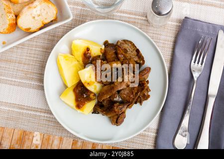 Fried rabbit liver served with boiled potato Stock Photo