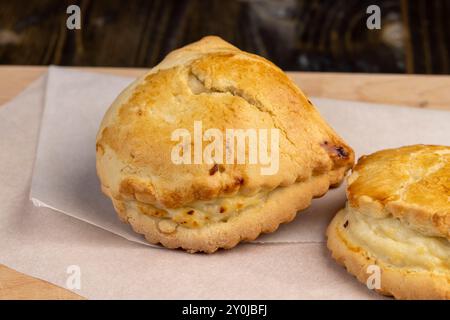 Sweet pastries made of shortbread dough and white cheese fillings, sweet soft curd filling and crispy crumbly dough in a homemade dessert Stock Photo