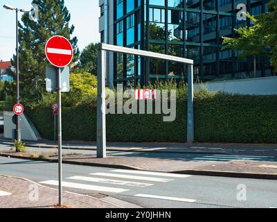 Road leading into the tunnel with a warning sign and a marking that can only pass at a certain height of the vehicle Stock Photo