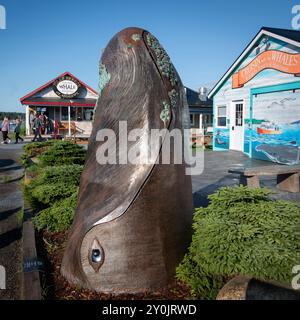 The Breach a large sculpture of the head of a whale by Ryan Moyes near the Market Wharf on King Street in Saint Andrews, New Brunswick, Canada. Stock Photo