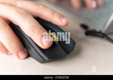 Image of female hand clicking computer mouse. earning on clicks. Stock Photo