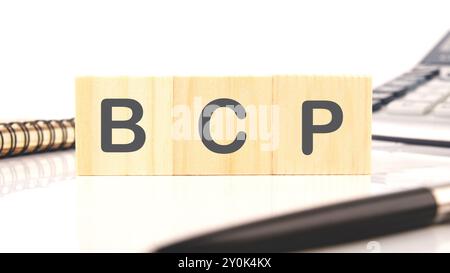 BCP Business Continuity Plan. BCP assembled from wooden cubes on a white background Stock Photo