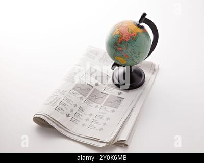 Newspaper and Globe Stock Photo