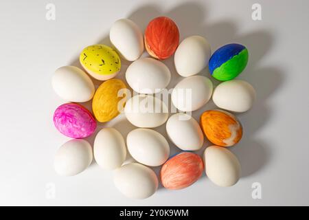 Happy easter. Colorful Easter eggs on white surface during Easter celebration. Stock Photo