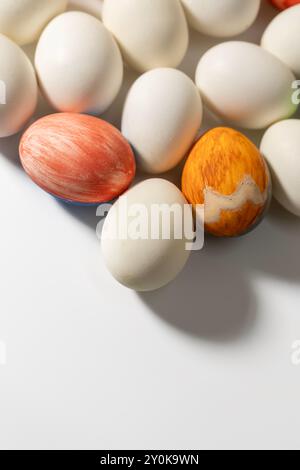 Happy Easter concept. Colorful Easter eggs on a white background with copy space for text. Stock Photo