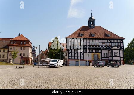 Waltershausen, Germany - June 10, 2023: In the picturesque town of Waltershausen, Germany, charming historic structures with half-timbered facades lin Stock Photo