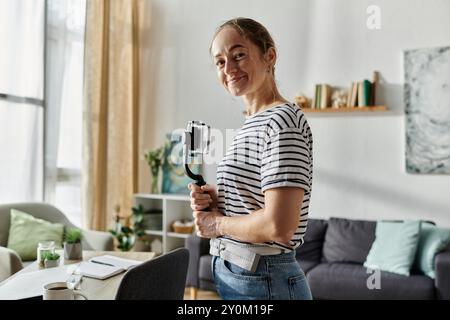 A joyful woman with vitiligo poses confidently with her camera. Stock Photo
