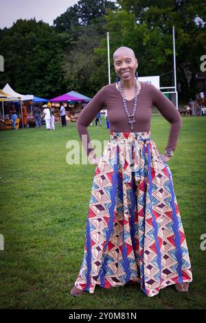 A female attendee of the annual Wakanda Celebration wearing distinctive ...