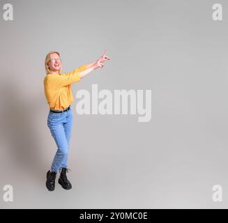 Cheerful sales manager aiming at copy space for business marketing on isolated white background Stock Photo