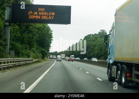 Sign warning of delay on M11 motorway at Harlow.  Heading south near Stansted. Stock Photo