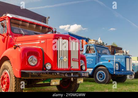 Aalten, The Netherlands - June 23, 2023: Row of colorful vintage trucks on a country fair in Aalten, The Netherlands Stock Photo