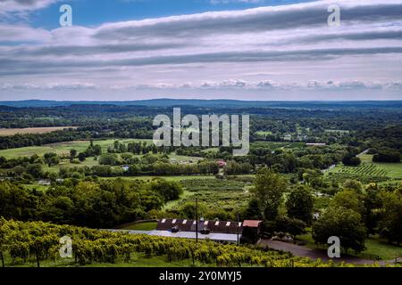 A dramatic landscape photograph that looks down over farms and vineyards of the Blue Ridge Mountains. Stock Photo
