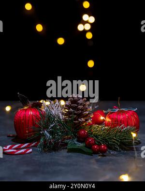 A pine cone with snowflakes and Christmas decorations with colored lights to celebrate the Christmas holidays Stock Photo