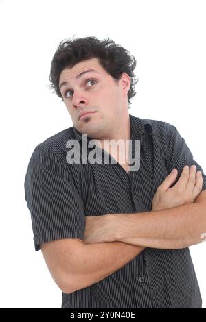 young man with clueless face expression playing innocent on white background Stock Photo