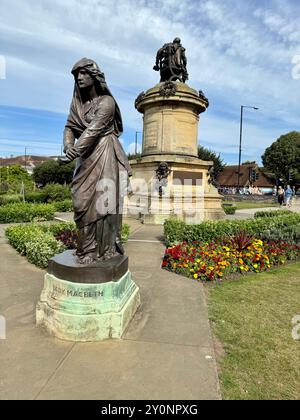 The statue of Lady Macbeth by The Gower Memorial in Bancroft Gardens. Stock Photo