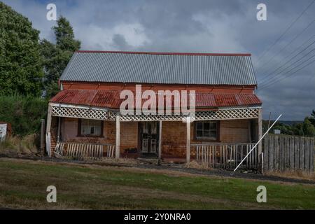 Exterior of a dilapidated building in the town of Waratah, which was constructed to support a tin mine at Mount Bischoff, Tasmania, Australia Stock Photo