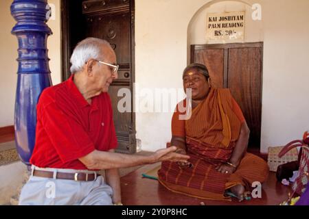 Man having his palm read, Dakshina Chitra, Chennai, Tamil Nadu, India Stock Photo