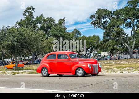 Gulfport, MS - October 07, 2023: Wide angle side  view of a 1940 Ford Deluxe Tudor Sedan at a local car show. Stock Photo