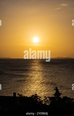 Beautiful sunset over small tourist town of Primosten, Croatia Stock Photo
