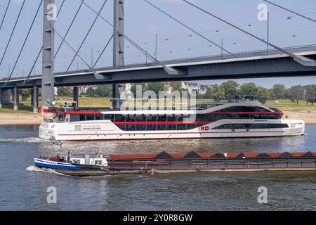 Shipping traffic on the Rhine near Düsseldorf, KD Schiff Rhein Galaxie, excursion ship, party ship, freighter Christa, loaded with coal for power plan Stock Photo