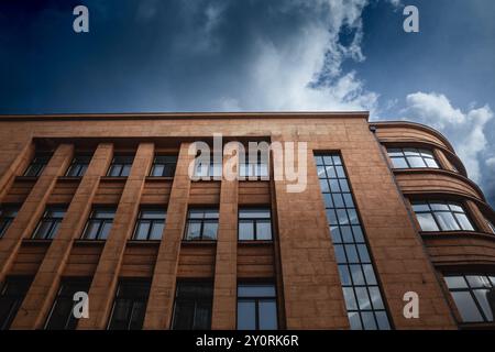 Facade of a 1930s business building in Riga, Latvia, featuring modernist architecture typical of the era. Stock Photo