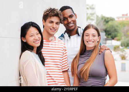 A diverse group of friends smiles joyfully outdoors, celebrating their bond while engaging in playful activities that reflect their vibrant lifestyles. Group of teenage students at university campus. High quality photo Stock Photo